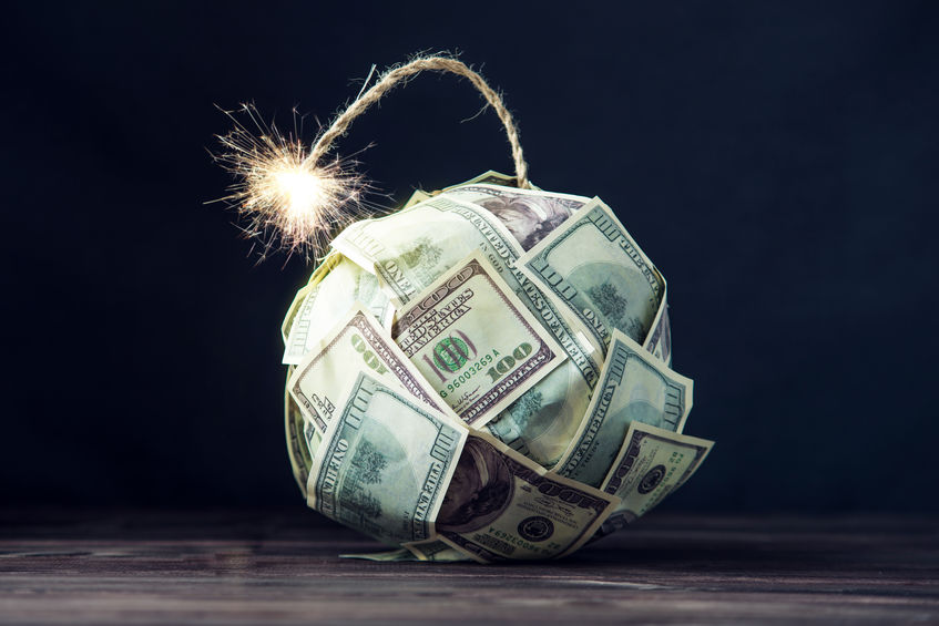 Bomb of money hundred dollar bills with a burning wick. Little time before the explosion. Concept of financial crisis Bomb of money hundred dollar bills with a burning wick. Little time before the explosion. Concept of financial crisis
