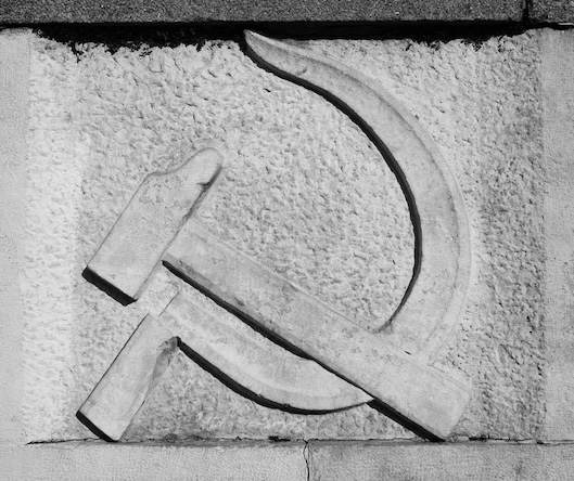 11167651 communist hammer and sickle symbol on stone. black and white picture 11167651 communist hammer and sickle symbol on stone. black and white picture