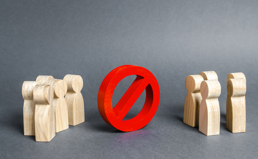 Two groups of people are divided by a red prohibition sign NO. prohibition, taboo, and rejection. Conservatism, misunderstanding new. Laws Restrictions of rights and freedoms. Civil conflict. Two groups of people are divided by a red prohibition sign NO. prohibition, taboo, and rejection. Conservatism, misunderstanding new. Laws Restrictions of rights and freedoms. Civil conflict.