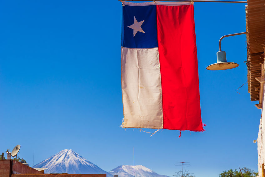 Flag of Chile and volcano Licancabur by San pedro de Atacama