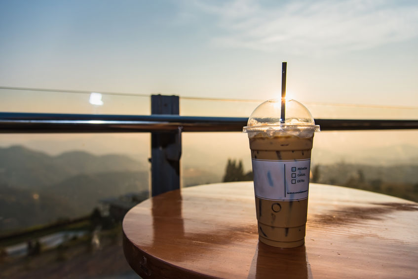 Icet Coffee cup on the table with Sunlight at morning.Thailand.