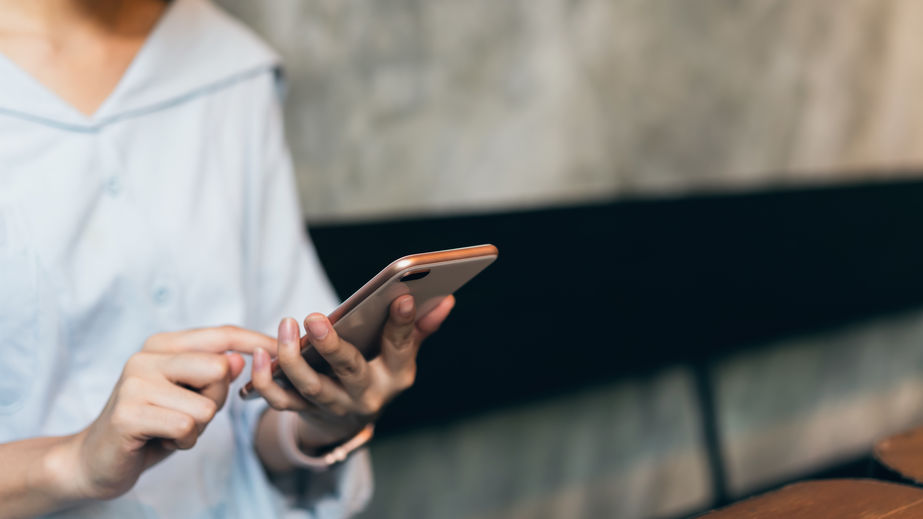Woman using smartphone, During leisure time. The concept of using the phone is essential in everyday life.