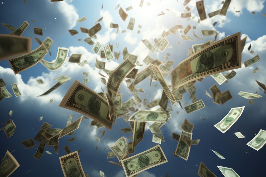 Money cash falling from the sky and flying everywhere