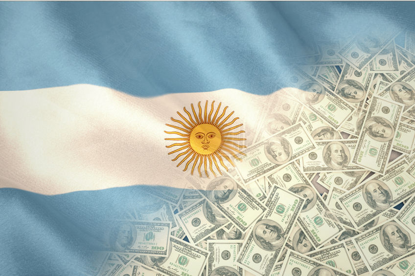 Pile of dollars against argentinian flag