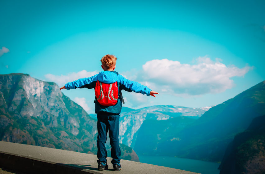 happy little boy enjoy travel in mountains, hiking in nature