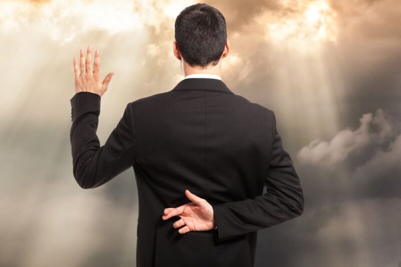 18466294 swearing an oath with fingers crossed behind back
