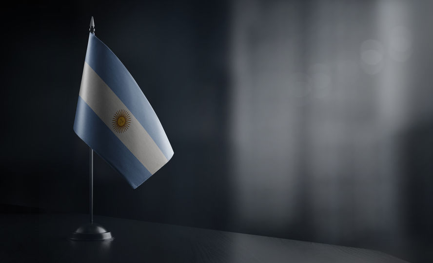 Small national flag of the Argentina on a black background