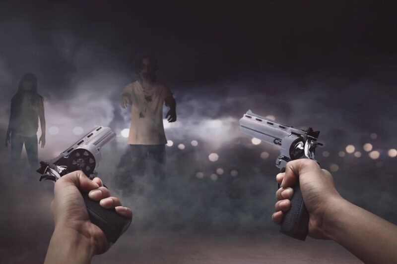 Man with two guns in his hand ready to shooting a lot creepy zom