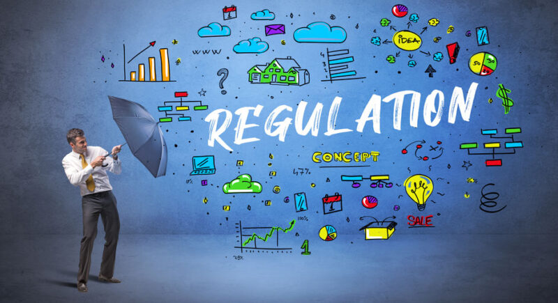 businessman hiding behind umbrella concept