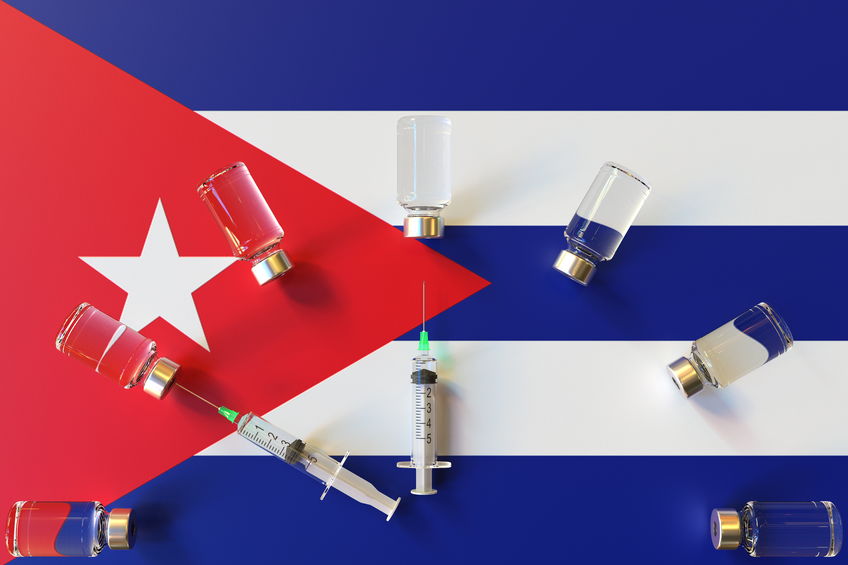 Syringes and medical vials on the flag of Cuba. Vaccination related conceptual 3D rendering