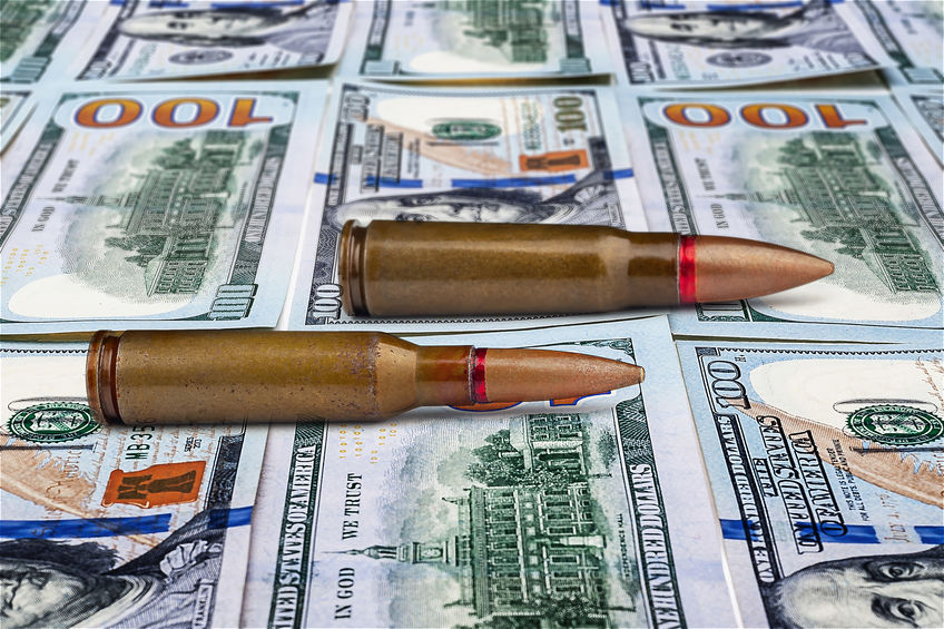 Bullets on dollar bills. The concept of military assistance. Sale of weapons. Military mercenary. Funding for crime. Military financial support