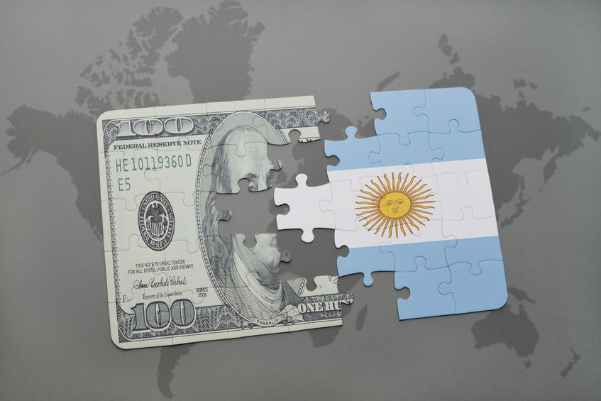 puzzle with the national flag of argentina and dollar banknote on a world map background.