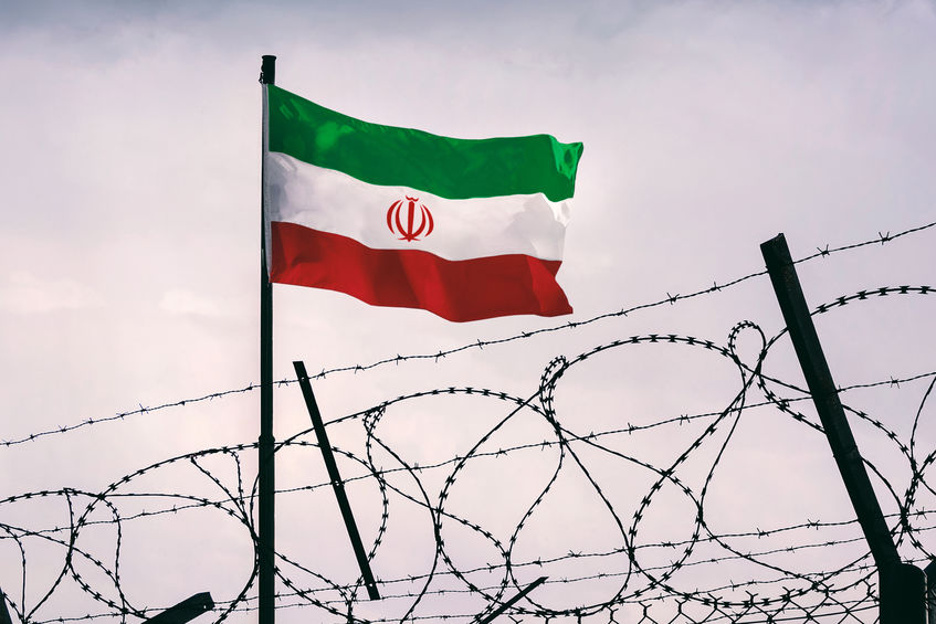 The concept of sanctions pressure on the iran government. Iranian flag in barbed wire, sanctions and aggression of iran. Iranian prison